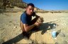 Balázs Buzás with Roman’s skull, Gebel al-Mawta (Mount of the Dead), 1 km N of Siwa Oasis, EGYPT. Photo: Albert Fábián