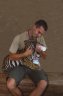 Balazs Buzas with a Tiger (<em>Panthera tigris</em>) juv., Si Racha Tiger Zoo, THAILAND