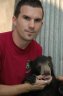 <p>Balázs Buzás with juv. Sun Bear (<em>Helarctos malayanus</em>), Angkor Zoo, Angkor, CAMBODIA</p>