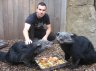 Balazs Buzas with Binturongs (<em>Arctictis binturong</em>), Rare Species Conservation Centre, Sandwich, UNITED KINGDOM. Photo: Adam Mitchell.