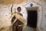 Berber woman with stuffed Dorcas Gazelle (<em>Gazella dorcas</em>), troglodytic berber house, ~ 10 km W of Matmata, TUNESIA