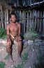 Dani tribesman wears koteka, Wamerek (1522 m), Baliem Gorge, Papua, INDONESIA