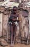 Dasanech boy with dog (<em>Canis familiaris</em>), 1 km SW of Omorate, near the Omo River (372 m), South Omo Valley, ETHIOPIA